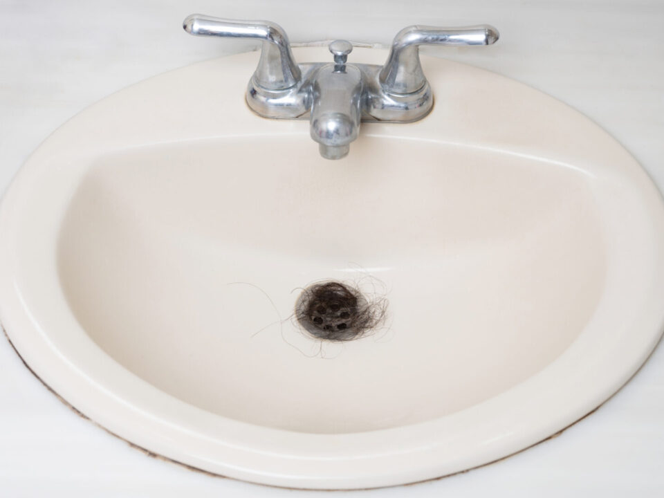 Nasty human hair in sink drain